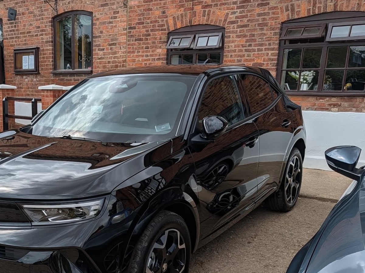 Glossy black car after an exterior valet