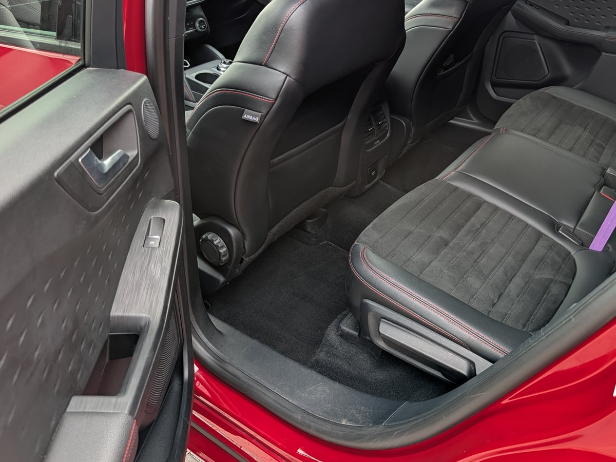 Vacuumed and cleaned rear passenger cabin